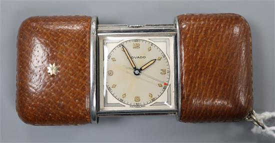 A 1930s steel and leather cased Movado travelling watch.